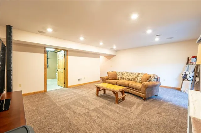 a view of storage and utility room with wooden floor