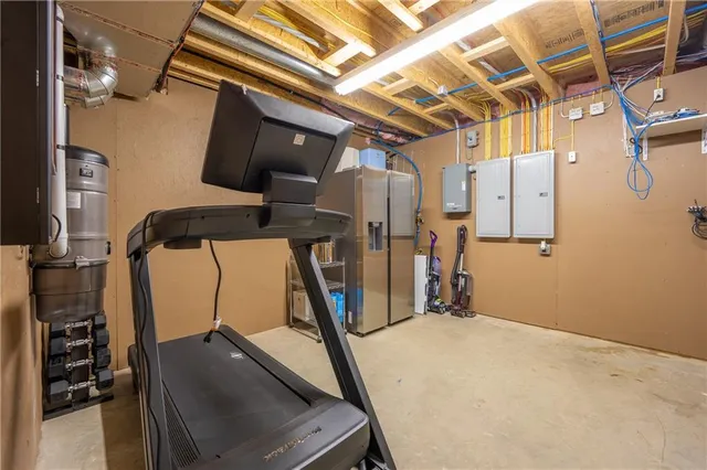 a view of a backyard with furniture and a grill