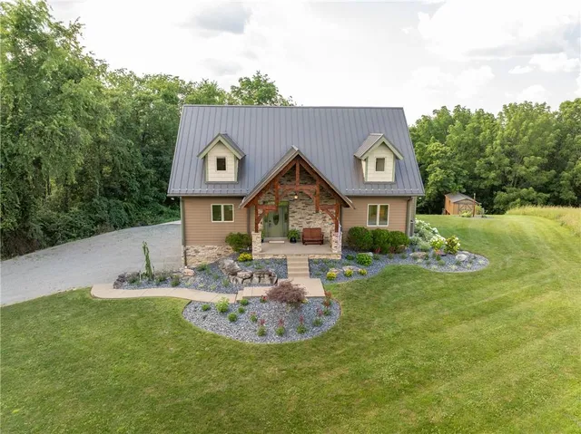 a front view of a house with garden