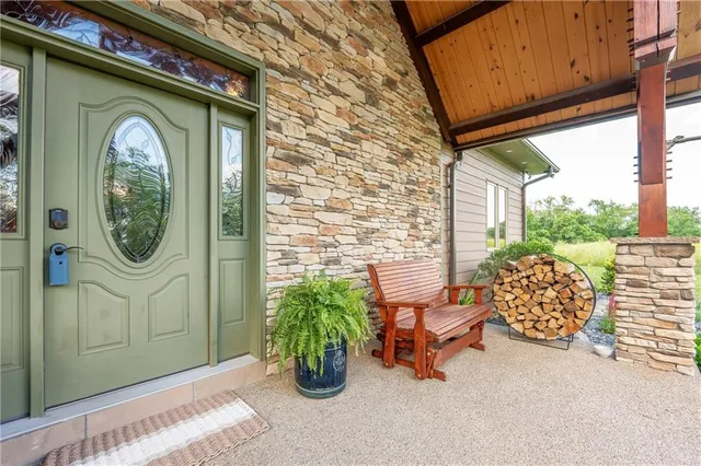 a building outdoor space with patio furniture and potted plants