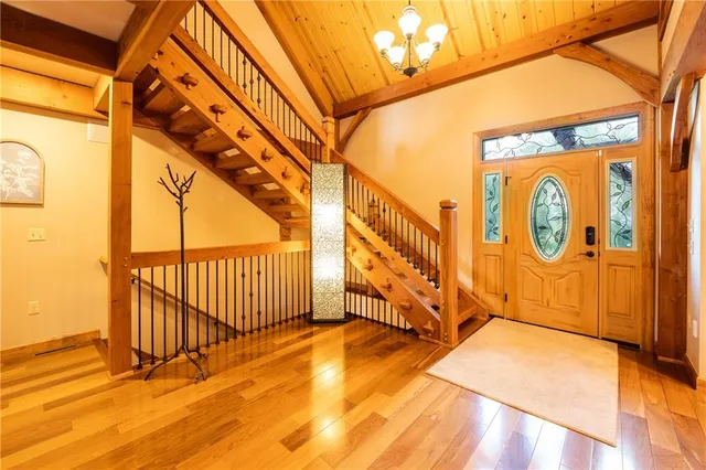 a dining hall with stainless steel appliances granite countertop a stove and a refrigerator