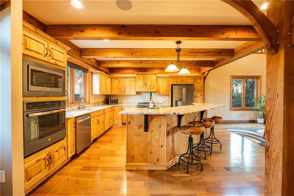 2780 Ipnar Road Irwin, PA 15642 - Photo 7 of 40 a dining hall with stainless steel appliances granite countertop a stove and a refrigerator