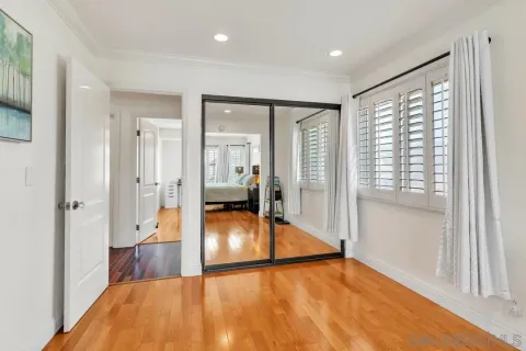 a bedroom with furniture and a window