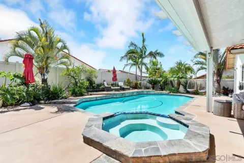 a view of a house with swimming pool