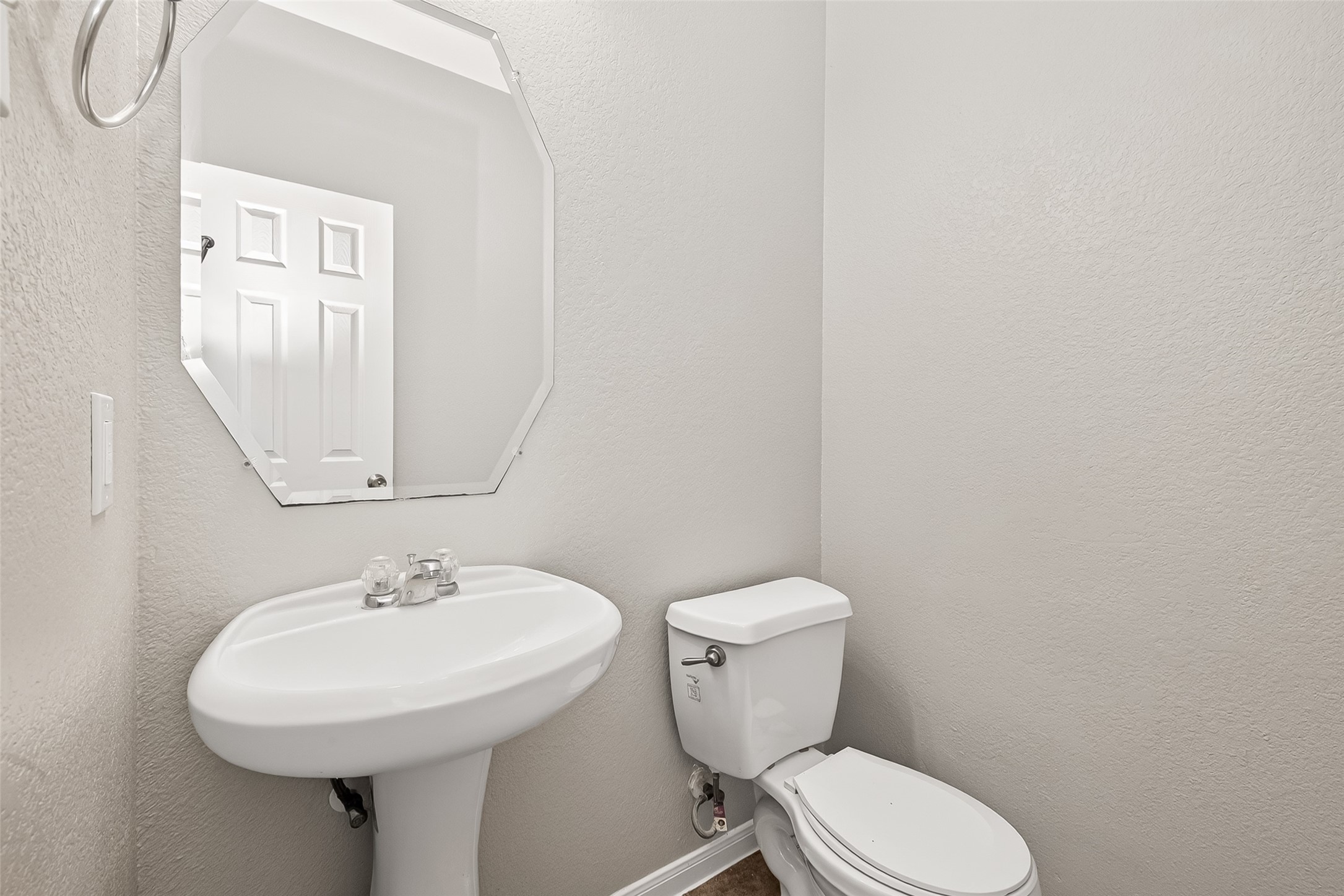 21327 Bella Flora Court Spring, TX 77379 - Photo 18 of 50 a white toilet sitting next to a white sink