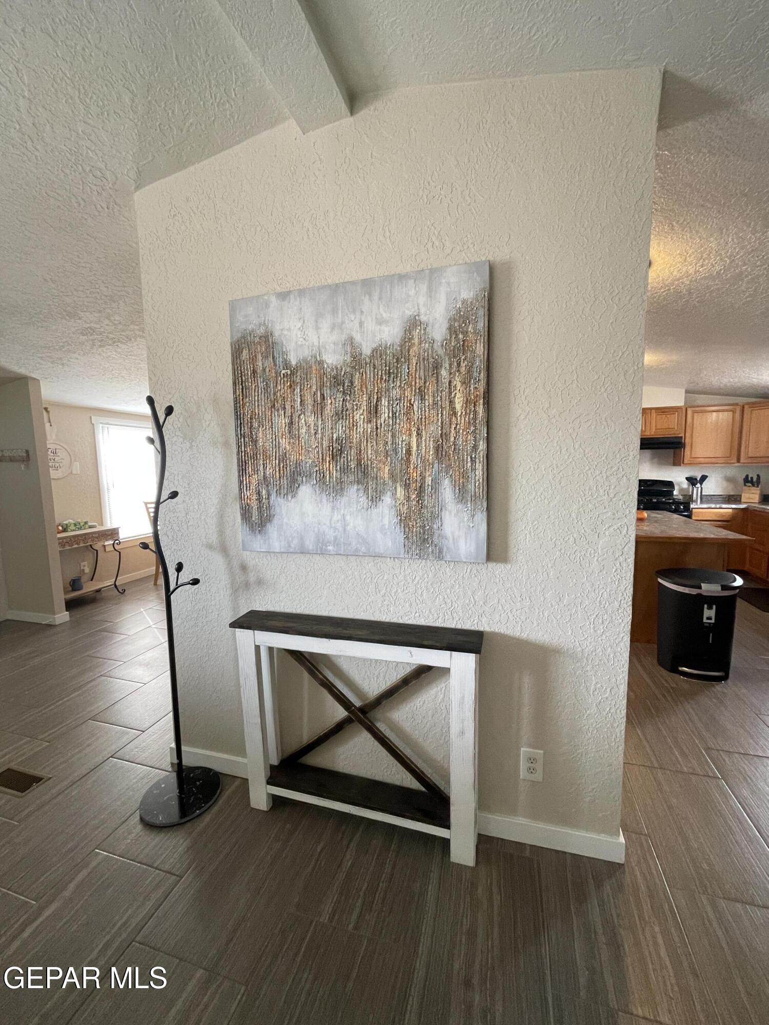 2901 Cook Street Truth Or Consequences, NM 87901 - Photo 10 of 28 a living room with furniture and a painting on the wall