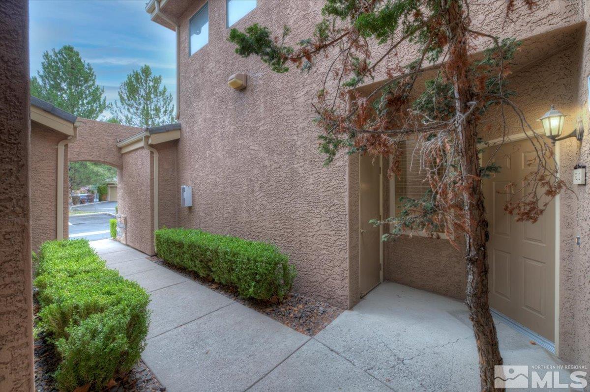 900 South Meadows Parkway, Unit 5212 Reno, NV 89521 - Photo 3 of 39 a view of a pathway along a building