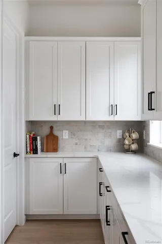 a kitchen with cabinets and white appliances