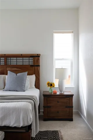 a bed room with a bed and window