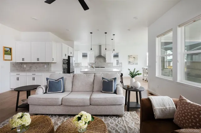 a living room with furniture and a large window