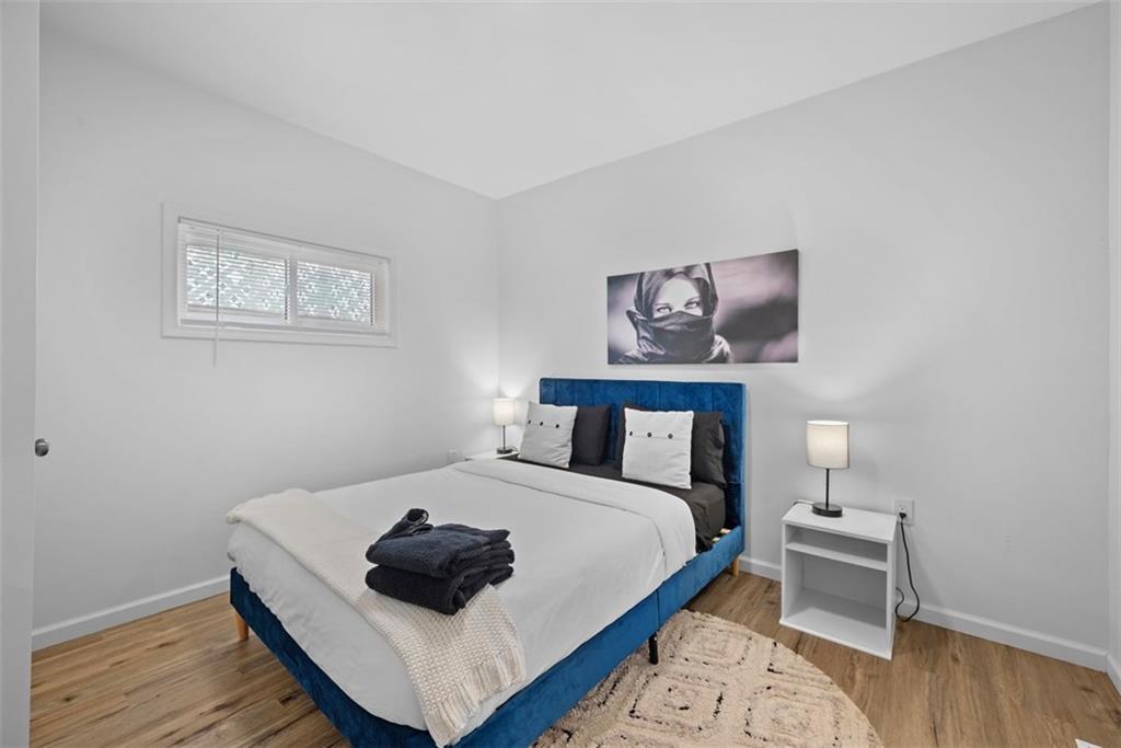 5270 Wickliff Street Pittsburgh, PA 15201 - Photo 14 of 33 a bedroom with a bed and a lamp on dresser