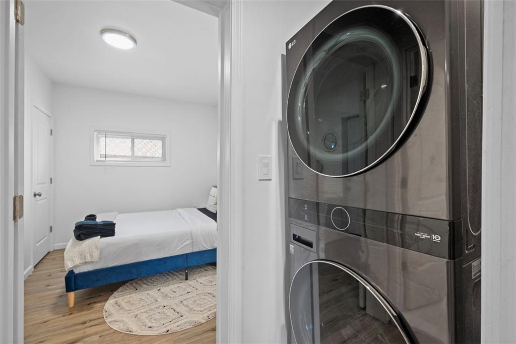 5270 Wickliff Street Pittsburgh, PA 15201 - Photo 16 of 33 a bedroom with a bed and a mirror