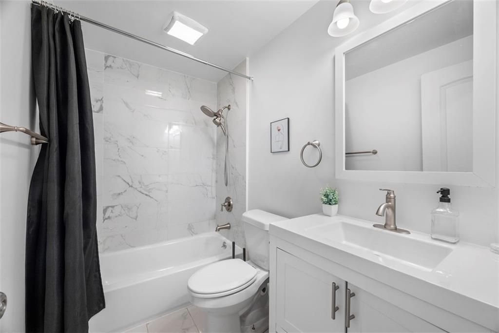 5270 Wickliff Street Pittsburgh, PA 15201 - Photo 21 of 33 a bathroom with a sink a toilet and shower