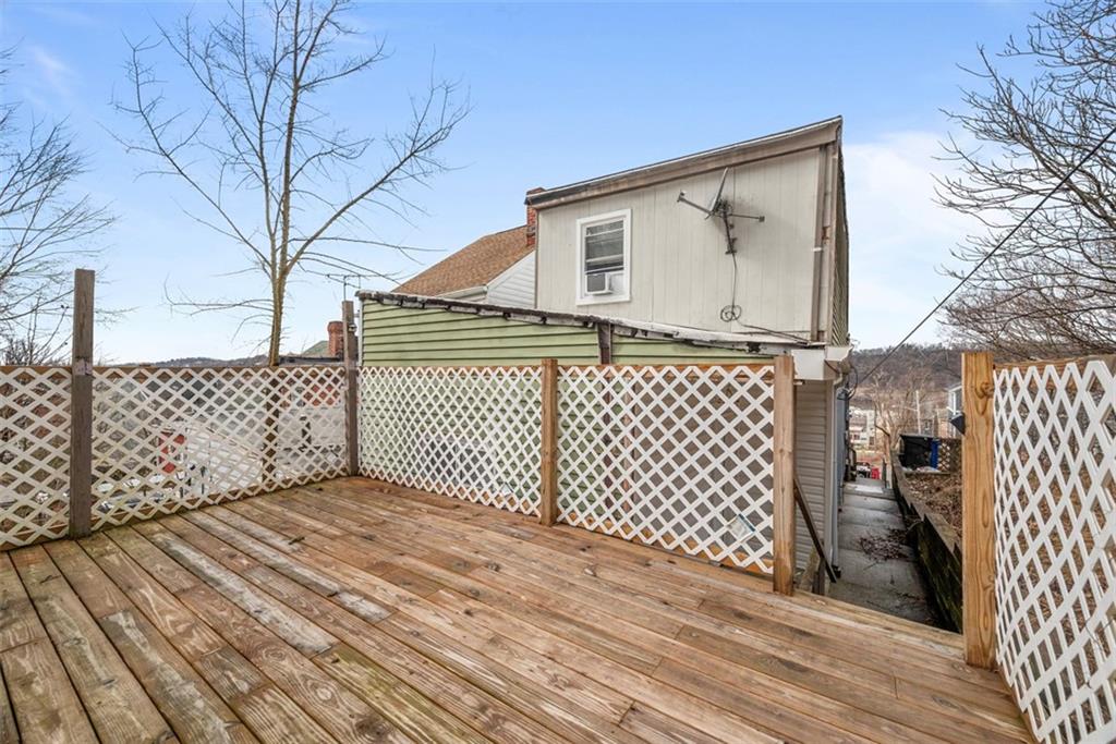 5270 Wickliff Street Pittsburgh, PA 15201 - Photo 28 of 33 a view of a brick house with wooden fence
