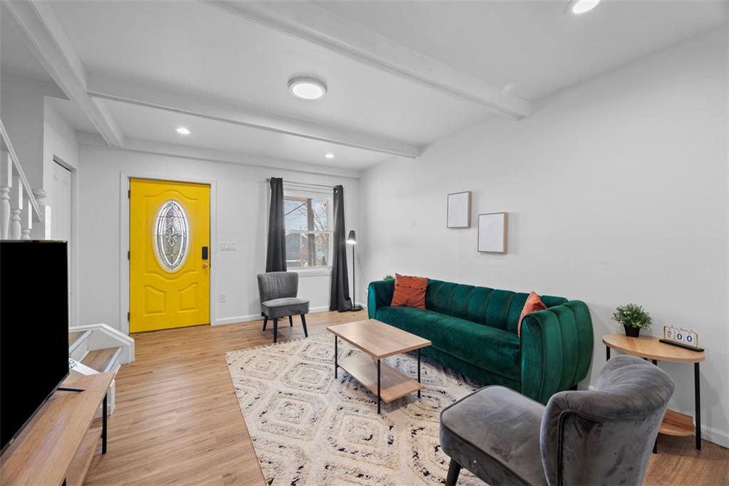 5270 Wickliff Street Pittsburgh, PA 15201 - Photo 4 of 33 a living room with furniture and a wooden floor