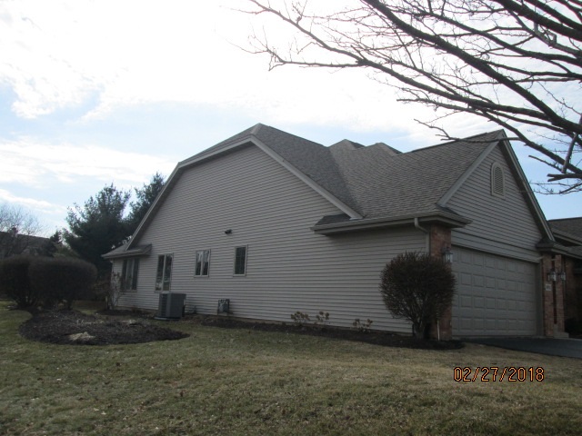 6911 Rote Road Rockford, IL 61107 - Photo 4 of 5 a house view with a backyard space