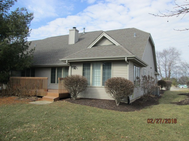 6911 Rote Road Rockford, IL 61107 - Photo 5 of 5 a front view of a house with garden