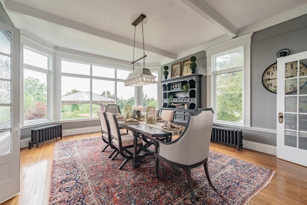 190 Longhill Street Springfield, MA 01108 - Photo 12 of 42 a dining room with furniture a chandelier and wooden floor