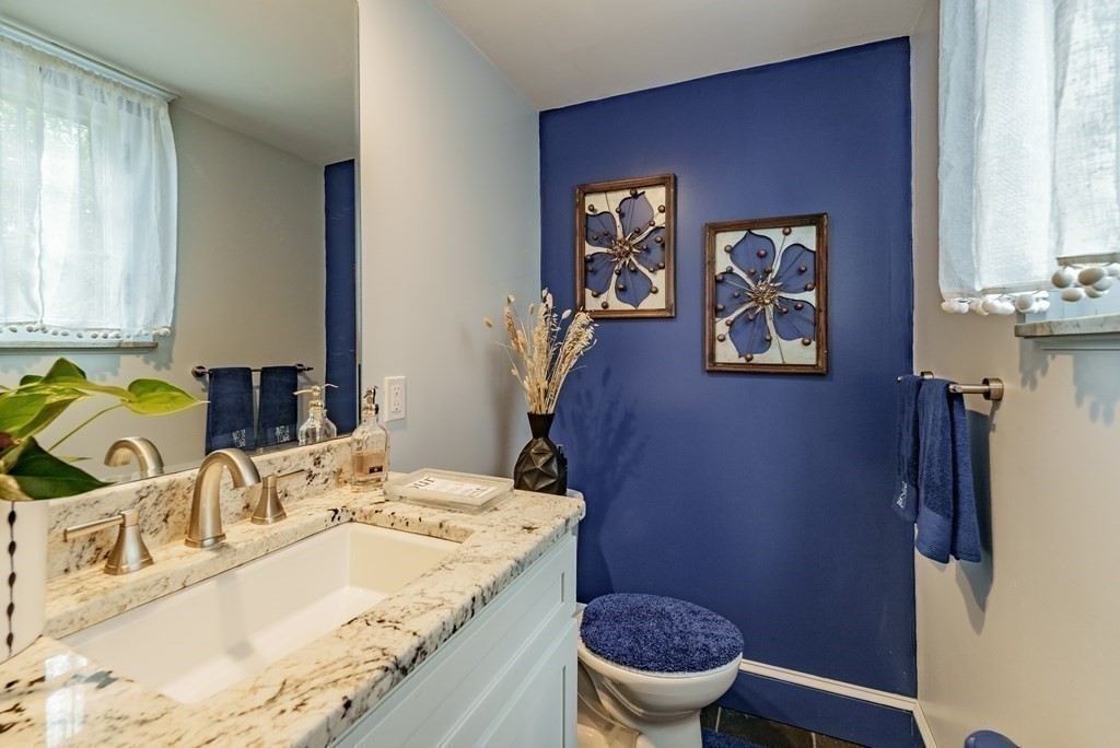 190 Longhill Street Springfield, MA 01108 - Photo 23 of 42 a bathroom with a granite countertop sink and a mirror