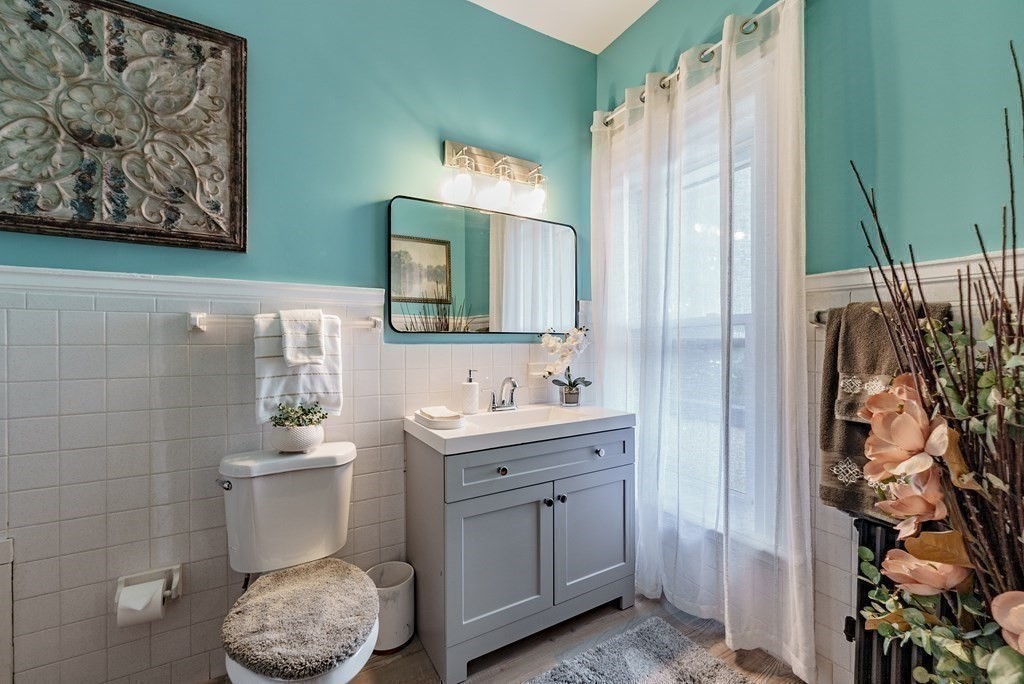 190 Longhill Street Springfield, MA 01108 - Photo 27 of 42 a bathroom with a toilet sink and mirror