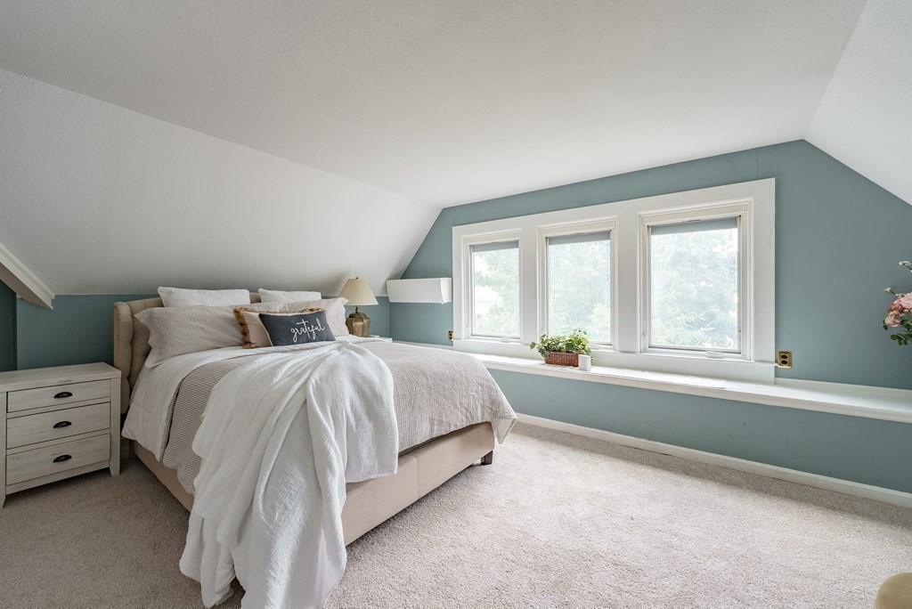 190 Longhill Street Springfield, MA 01108 - Photo 35 of 42 a spacious bedroom with a bed and a large window
