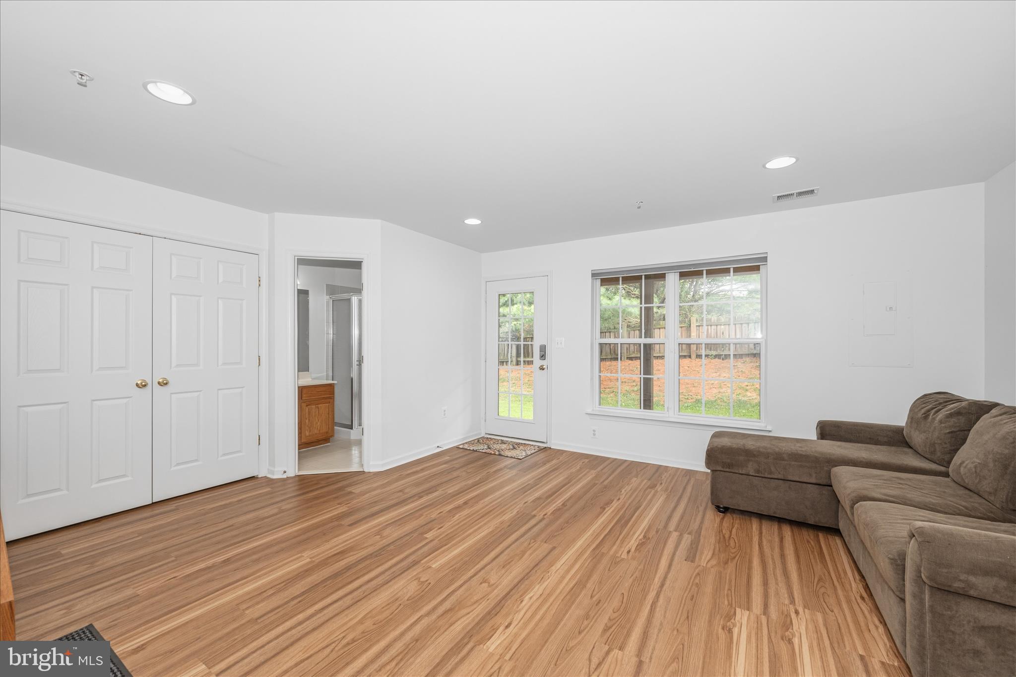 21 Inkberry Circle Gaithersburg, MD 20877 - Photo 41 of 51 a living room with a bed furniture and next to a window