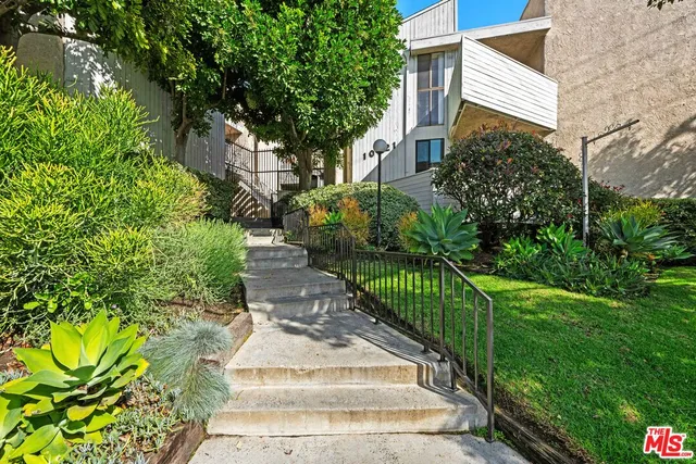 a view of a garden with pathway