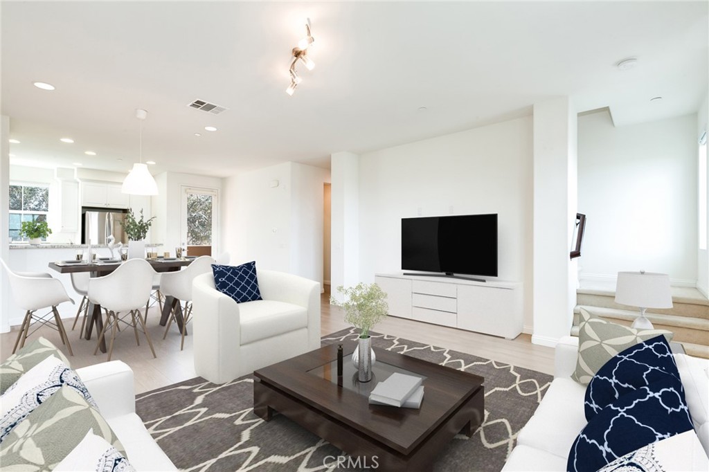 83 Aliso Ridge Loop Mission Viejo, CA 92691 - Photo 1 of 1 Virtually Staged Dining Room and Family Room