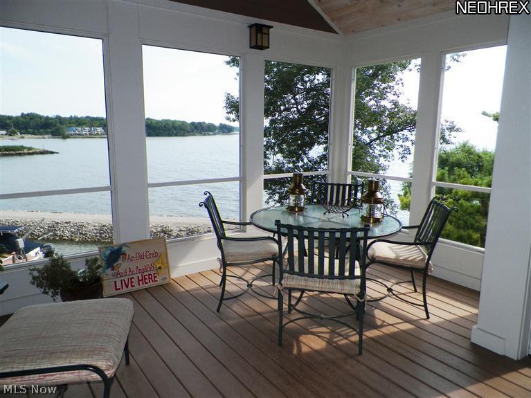 2730 North Bluff Ridge Drive Port Clinton, OH 43452 - Photo 10 of 25 The three season porch has wonderful views of Lake Erie and sunsets.