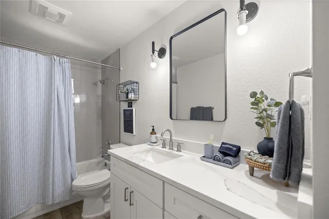 a living room with furniture fireplace and a flat screen tv