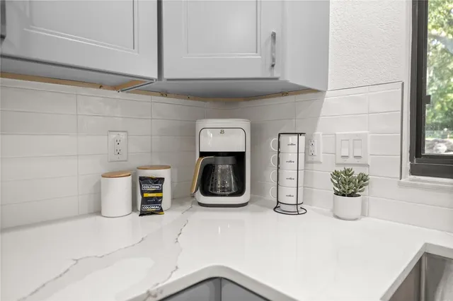 a kitchen with a two sink and a window