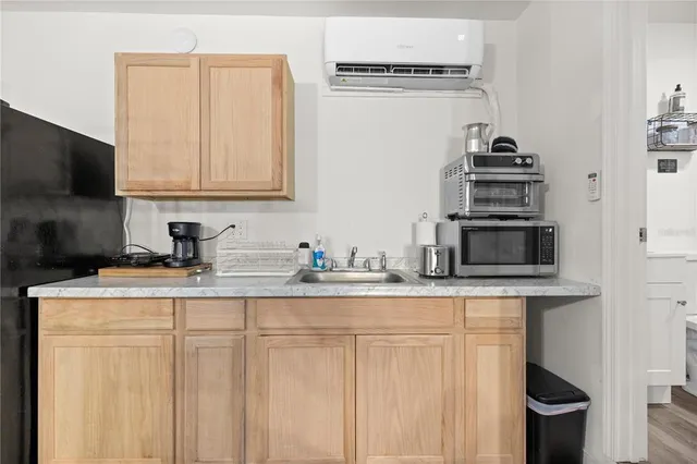 a view of a house with a yard and garage