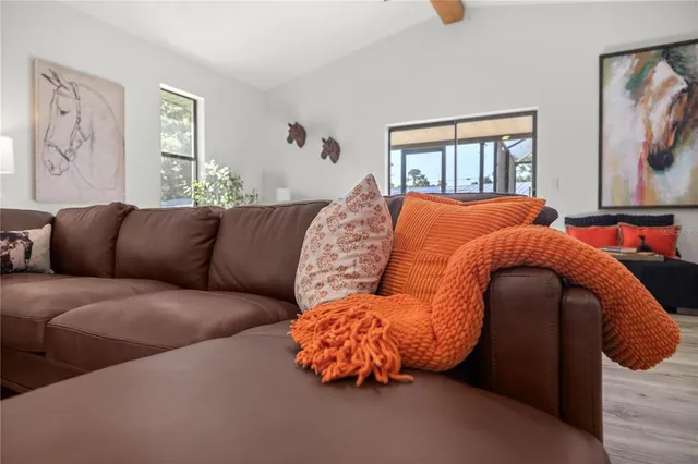 a living room with furniture and a window