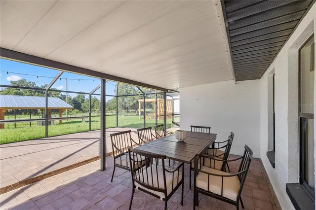 a view of a backyard of the house