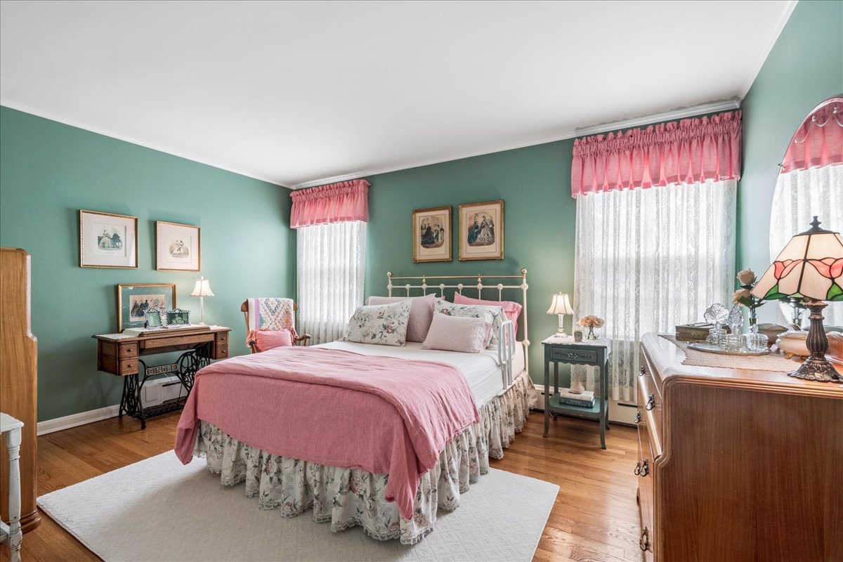2234 Central Street, Unit 3 Evanston, IL 60201 - Photo 13 of 19 a bedroom with a bed and wooden floor