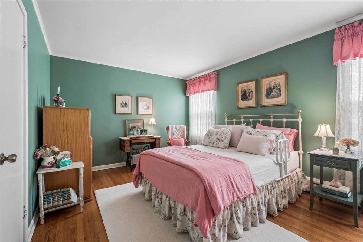 2234 Central Street, Unit 3 Evanston, IL 60201 - Photo 14 of 19 a bed room with a bed and a chair