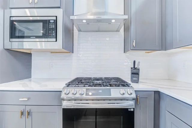 a kitchen with a sink cabinets and a window