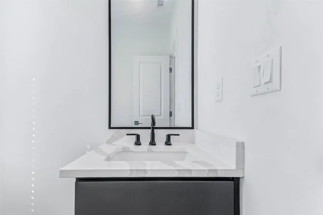 a bathroom with a sink a toilet and a bathtub