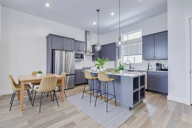 a kitchen with a table and chairs in it