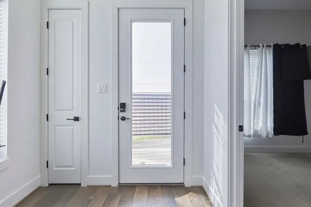 a view of a hallway with front door