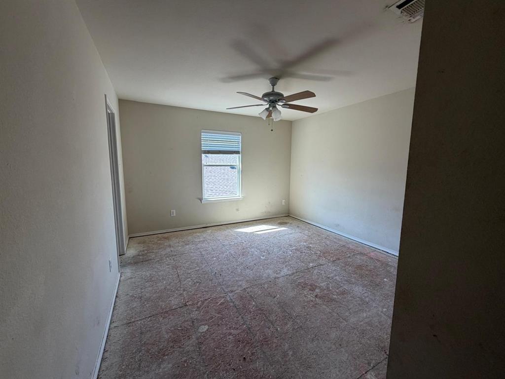 10400 Wagon Rut Court Fort Worth, TX 76108 - Photo 24 of 26 Empty room with a ceiling fan