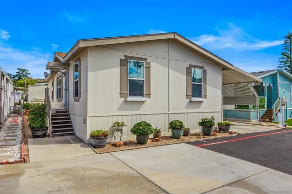 a front view of a house with garage