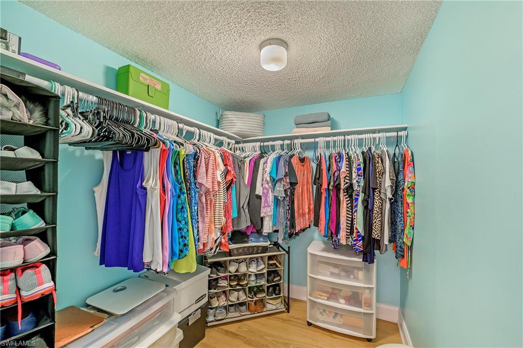 5737 Whitaker Road, Unit C103 Naples, FL 34112 - Photo 17 of 22 a view of a walk in closet