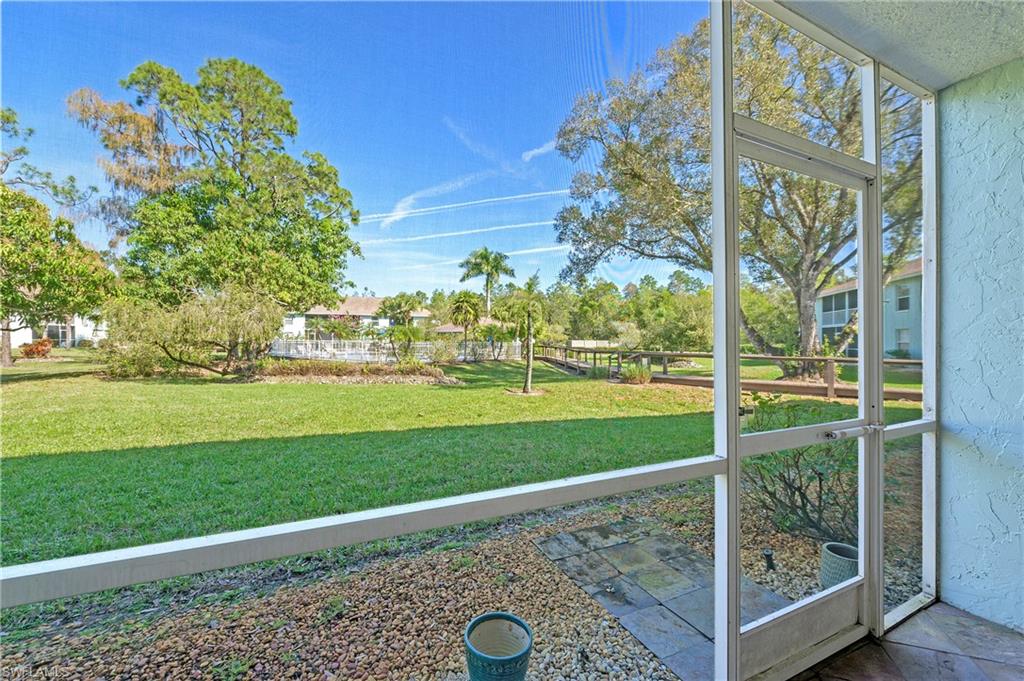5737 Whitaker Road, Unit C103 Naples, FL 34112 - Photo 20 of 22 a view of a garden area