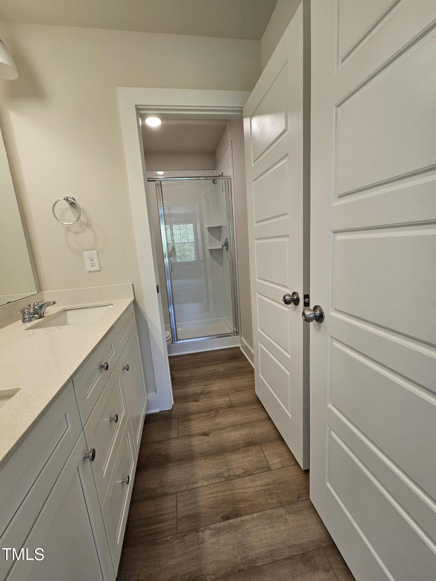 144 Gin Br Road Wendell, NC 27591 - Photo 13 of 18 a bathroom with a sink a mirror and a shower