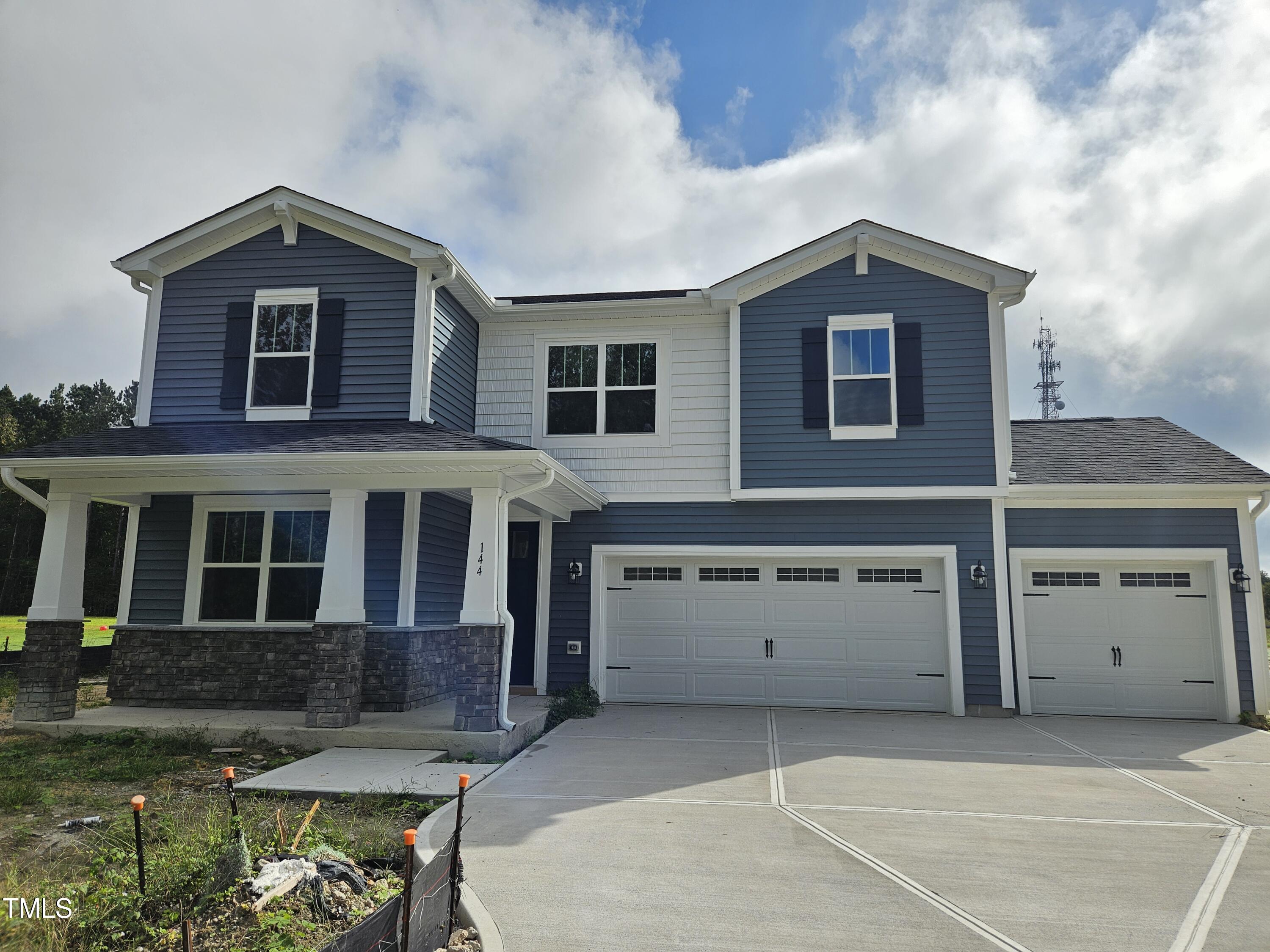 144 Gin Br Road Wendell, NC 27591 - Photo 2 of 18 front view of a house with a yard