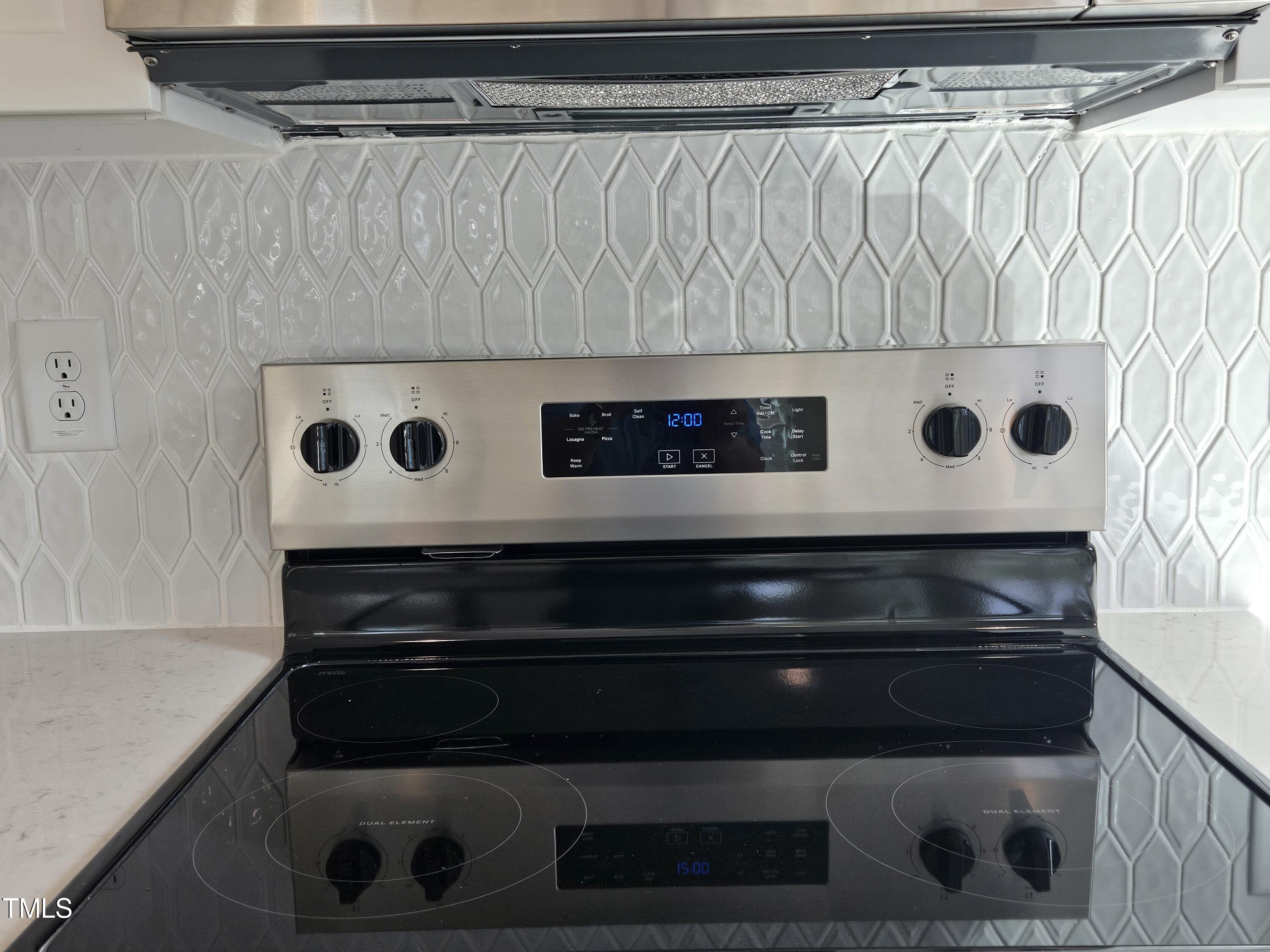 144 Gin Br Road Wendell, NC 27591 - Photo 5 of 18 a stove top oven sitting inside of a kitchen