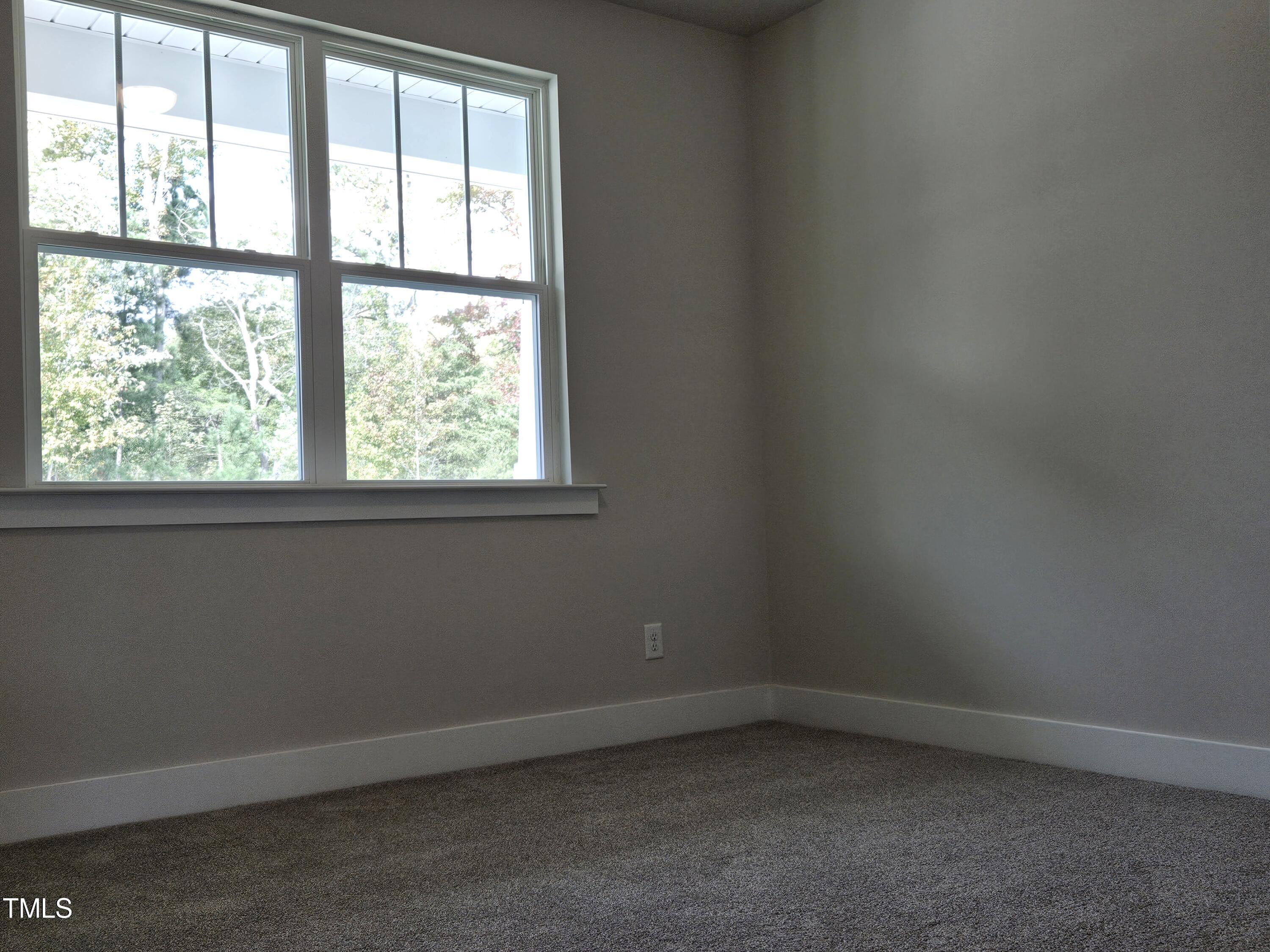 144 Gin Br Road Wendell, NC 27591 - Photo 8 of 18 an empty room with a window