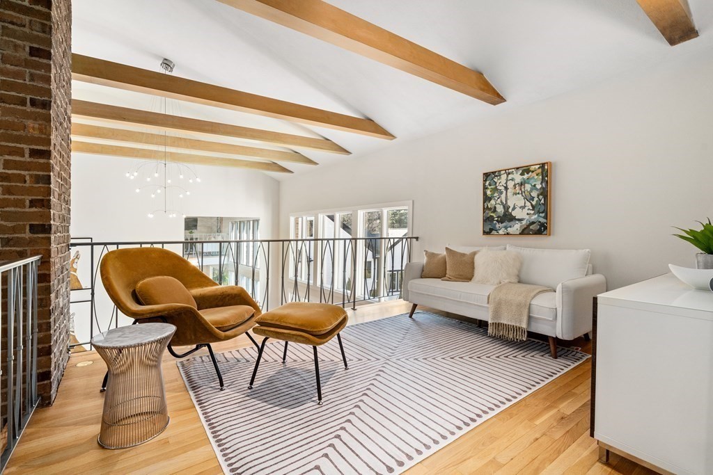 9 Newbrook Circle Newton, MA 02467 - Photo 11 of 28 a living room with furniture and a chair