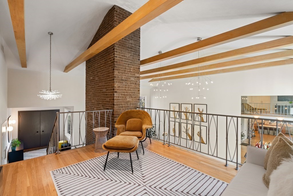 9 Newbrook Circle Newton, MA 02467 - Photo 12 of 28 a balcony with chairs and wooden floor